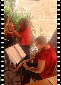 A person playing a musical instrument

AI-generated content may be incorrect.